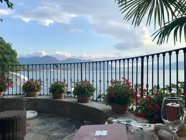 Terrace dinner at sunset on Lake Maggiore, Italy